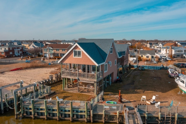 49 Bayview Ave W, Lindenhurst, NY 11757 - rear view of property featuring a patio area, a residential view, a wooden deck, and roof with shingles