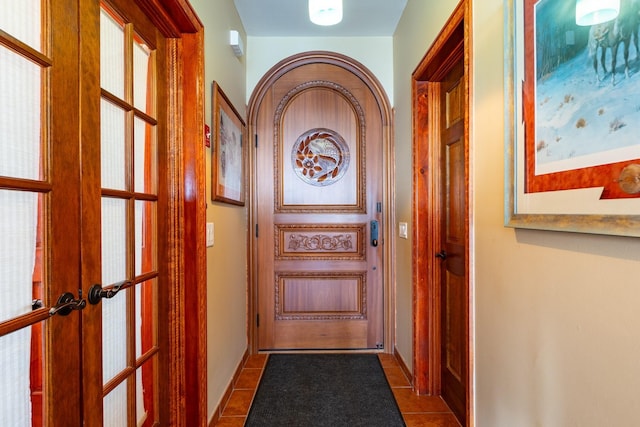 49 Bayview Ave W, Lindenhurst, NY 11757 - doorway with french doors and dark tile patterned floors