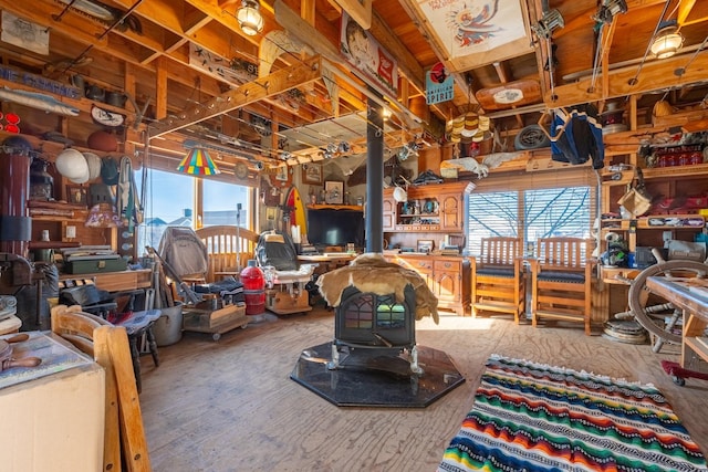 49 Bayview Ave W, Lindenhurst, NY 11757 - miscellaneous room with a healthy amount of sunlight and a wood stove