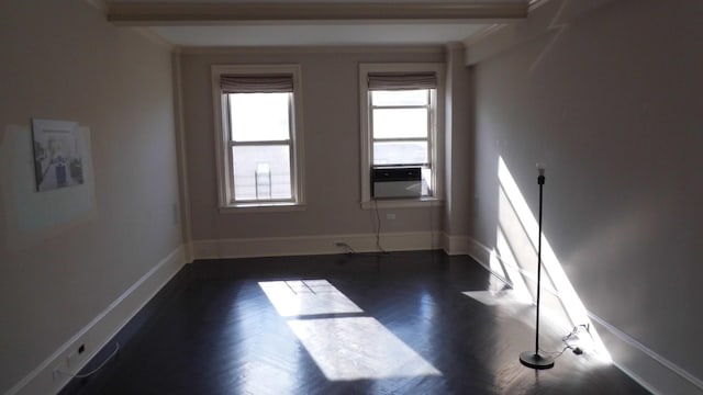 spare room with crown molding, dark hardwood / wood-style floors, and cooling unit