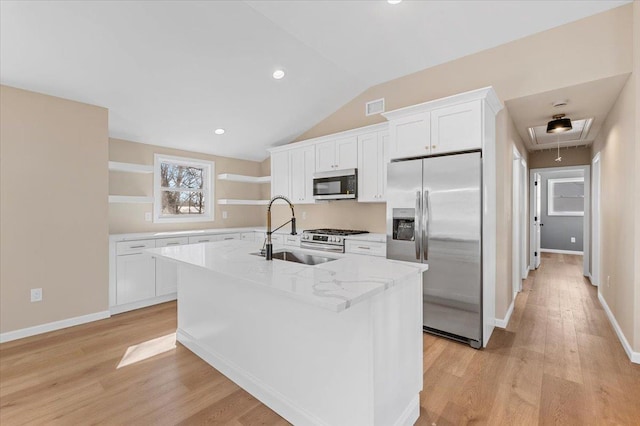 kitchen featuring visible vents, white cabinets, appliances with stainless steel finishes, open shelves, and a sink