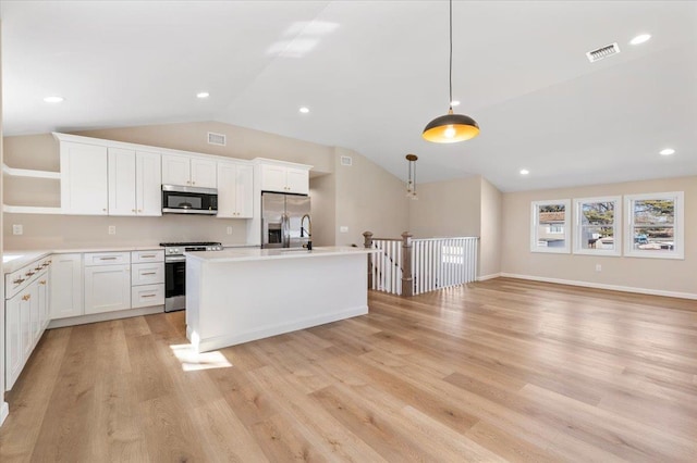 kitchen featuring visible vents, white cabinetry, appliances with stainless steel finishes, open shelves, and light wood finished floors