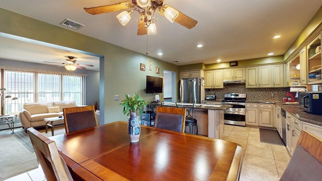 dining space featuring light tile patterned floors