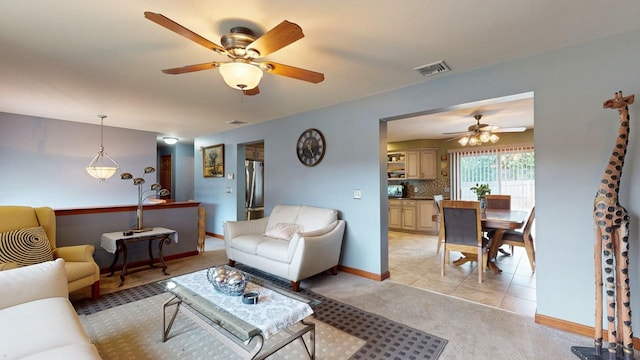 carpeted living room featuring ceiling fan