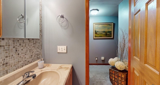 bathroom with vanity and decorative backsplash