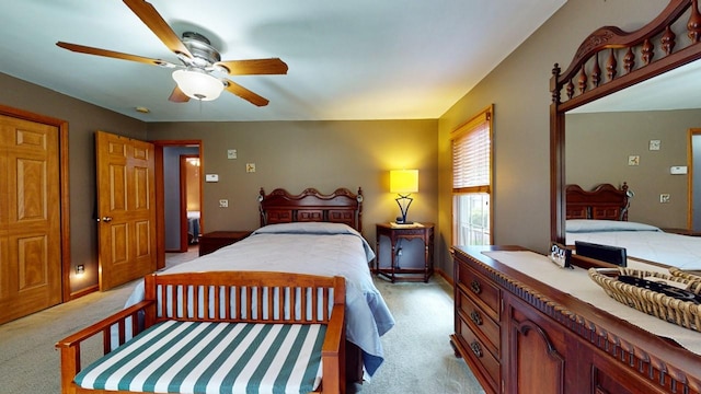 bedroom featuring ceiling fan and light carpet