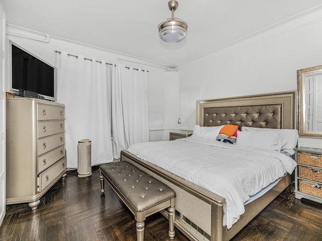 bedroom featuring dark parquet flooring