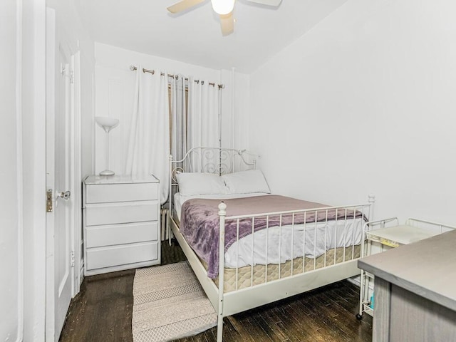 bedroom featuring dark hardwood / wood-style floors and ceiling fan