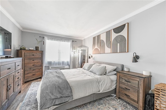 bedroom featuring ornamental molding, dark hardwood / wood-style floors, and a wall unit AC