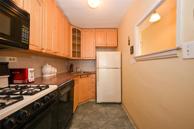 kitchen with decorative backsplash, sink, light brown cabinets, and black appliances