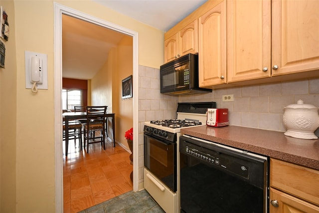 kitchen with dark tile patterned flooring, decorative backsplash, light brown cabinetry, and black appliances