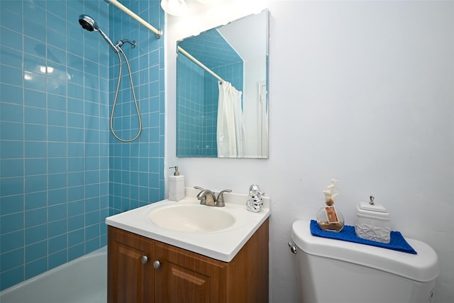 full bathroom with vanity, shower / tub combo, and toilet