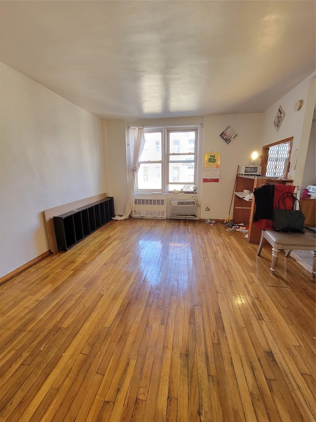 misc room with hardwood / wood-style flooring and baseboards