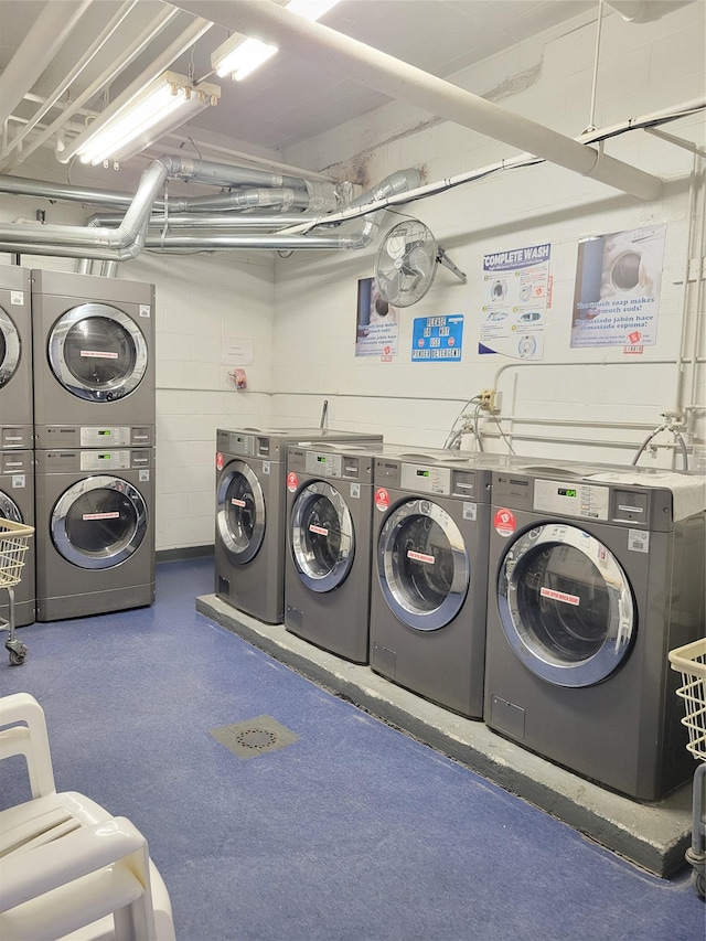 shared laundry area with stacked washer and clothes dryer and washing machine and clothes dryer