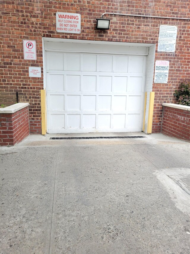 garage featuring driveway