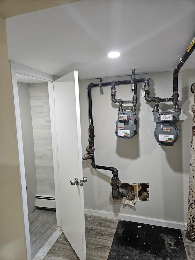 utility room with a baseboard radiator