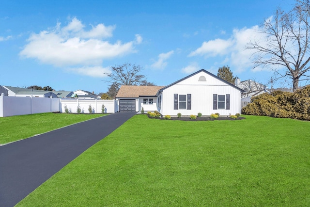 single story home featuring a garage and a front yard