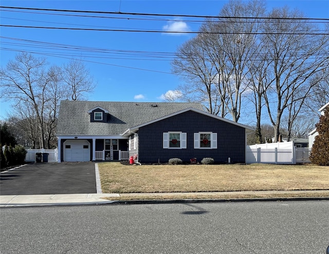 view of front of house with a garage and a front yard