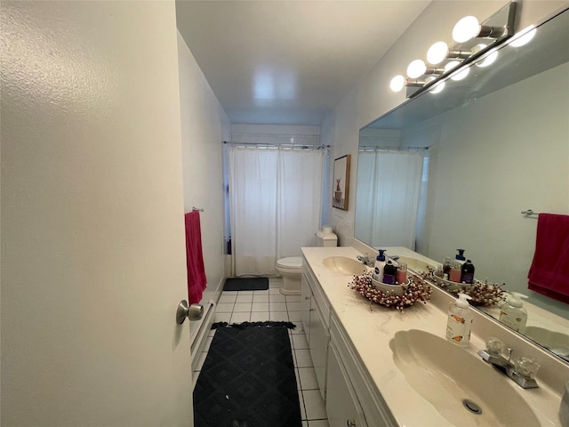 bathroom with vanity, tile patterned floors, and toilet