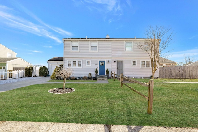 front facade with a garage and a front yard