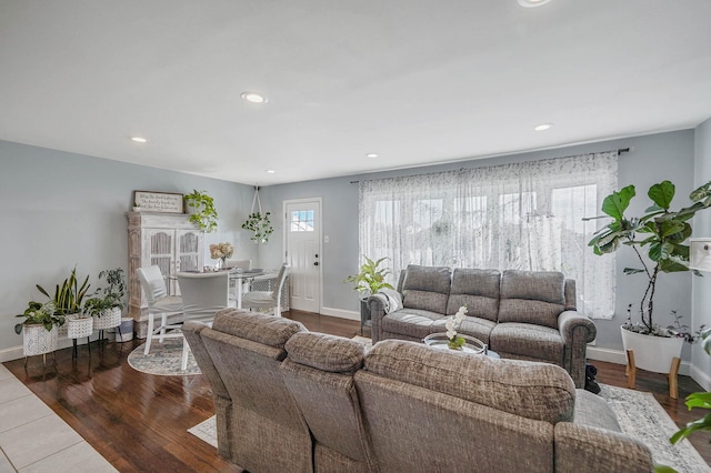 living room with hardwood / wood-style flooring and a wealth of natural light