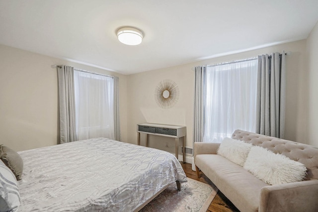 bedroom with hardwood / wood-style flooring