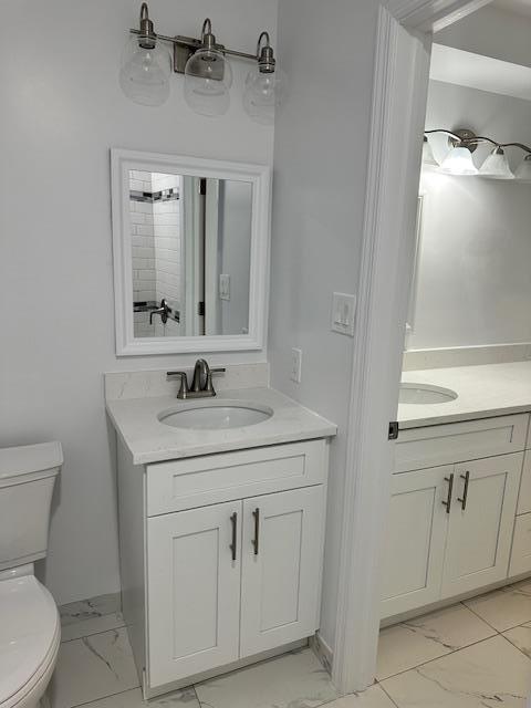 bathroom with vanity and toilet