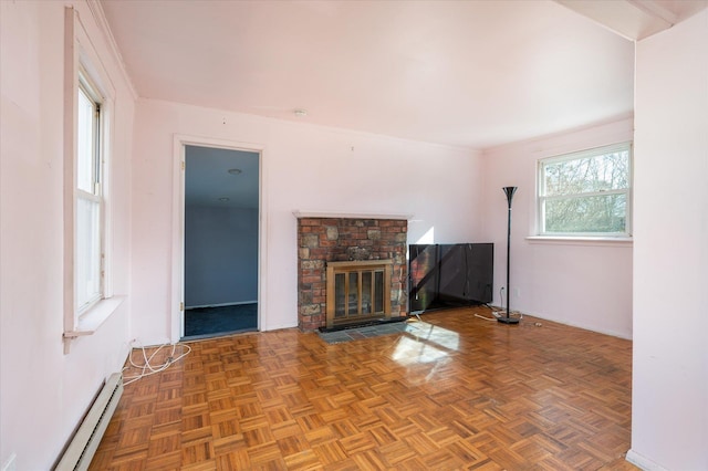 unfurnished living room with crown molding, parquet flooring, and a baseboard radiator