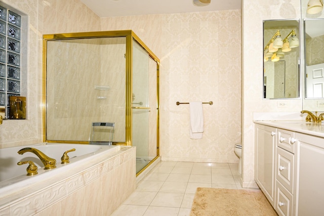 full bathroom with tile patterned flooring, vanity, independent shower and bath, and toilet