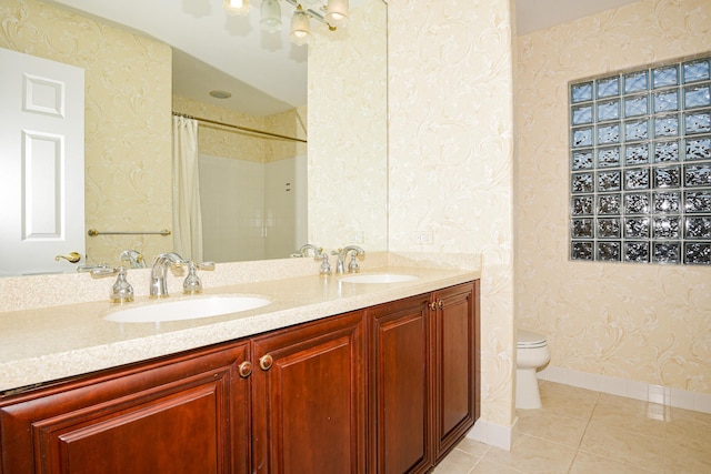 bathroom with a shower with curtain, tile patterned floors, toilet, and vanity