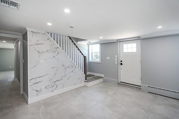 entryway featuring ornamental molding, recessed lighting, visible vents, and stairway