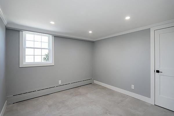 empty room featuring recessed lighting, baseboards, a baseboard heating unit, and ornamental molding