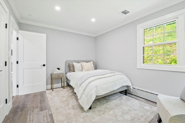 8 Fairway Pl, Cold Spring Harbor, NY 11724 - bedroom featuring wood finished floors, ornamental molding, recessed lighting, and a baseboard heating unit