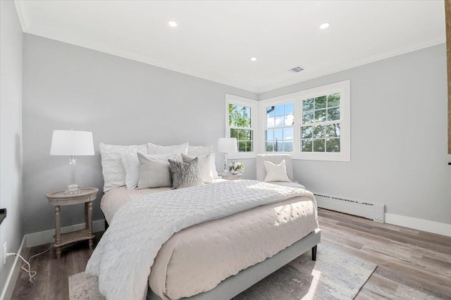 8 Fairway Pl, Cold Spring Harbor, NY 11724 - bedroom with baseboard heating, wood finished floors, ornamental molding, and recessed lighting