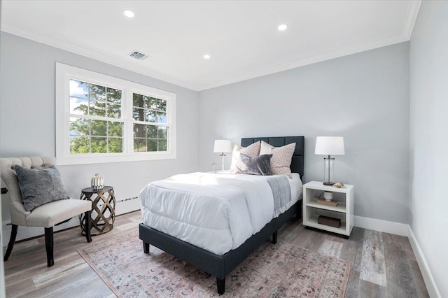 8 Fairway Pl, Cold Spring Harbor, NY 11724 - bedroom with crown molding, wood finished floors, recessed lighting, and a baseboard heating unit