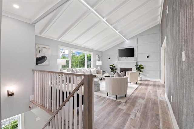 8 Fairway Pl, Cold Spring Harbor, NY 11724 - living room with wood finished floors, lofted ceiling, and a fireplace