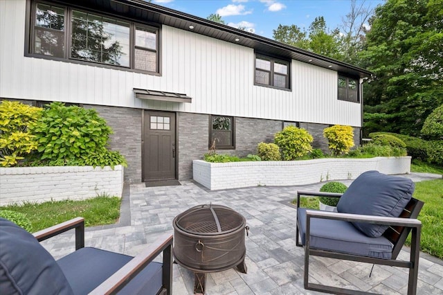 8 Fairway Pl, Cold Spring Harbor, NY 11724 - view of patio / terrace with a fire pit
