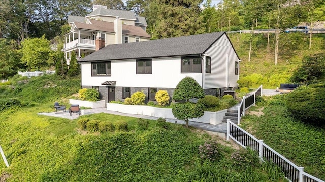 8 Fairway Pl, Cold Spring Harbor, NY 11724 - back of house with a patio, a chimney, and a shingled roof