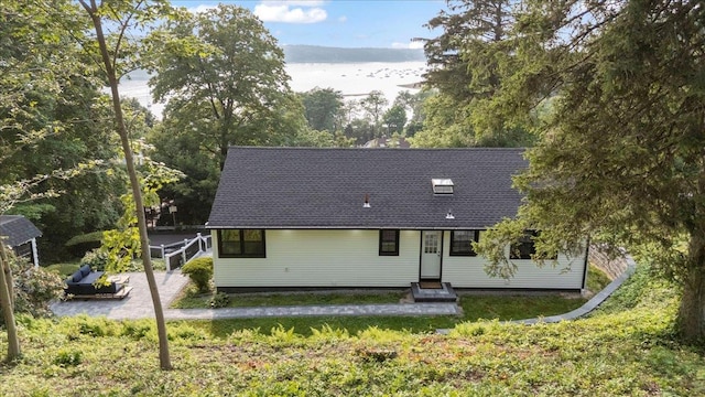 8 Fairway Pl, Cold Spring Harbor, NY 11724 - rear view of property with entry steps and a lawn