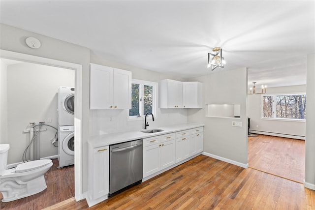 kitchen featuring sink, wood-type flooring, dishwasher, white cabinets, and a baseboard heating unit