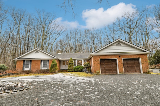 ranch-style home featuring a garage