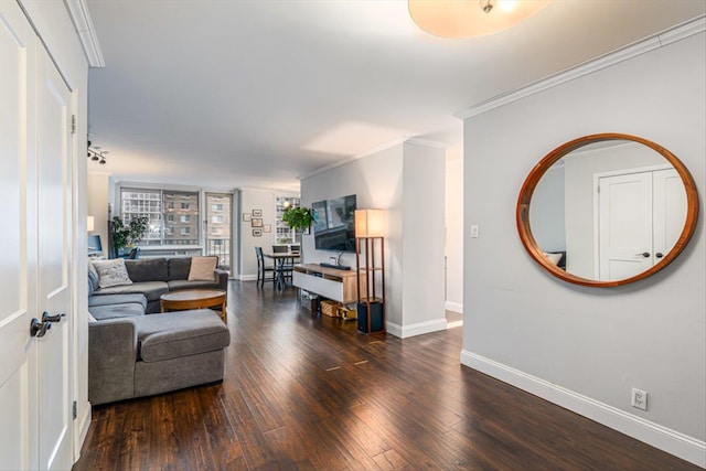 living room with crown molding and dark hardwood / wood-style floors