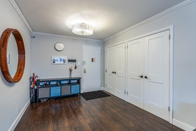 foyer featuring crown molding and dark wood-type flooring