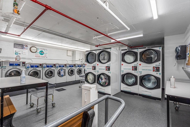 laundry room featuring stacked washer and clothes dryer and washer and dryer