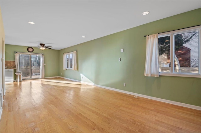 empty room with light hardwood / wood-style floors and ceiling fan