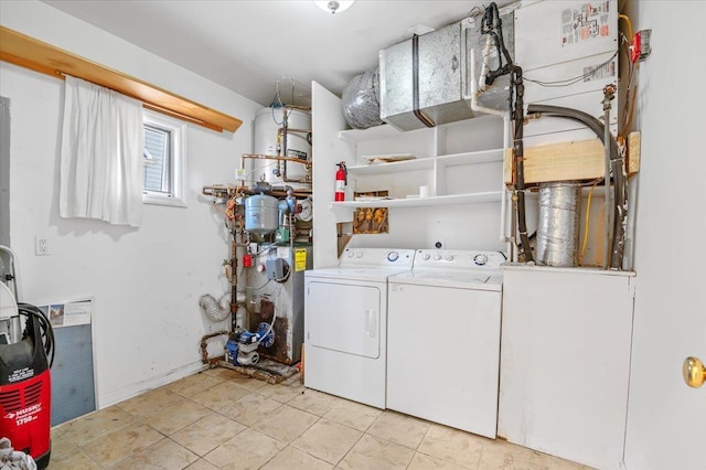 laundry area featuring separate washer and dryer and light tile patterned floors