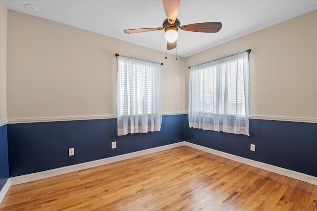 empty room featuring ceiling fan and light hardwood / wood-style floors