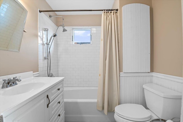 full bathroom featuring vanity, shower / bath combination with curtain, and toilet