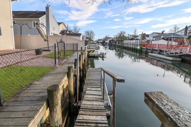 dock area with a water view