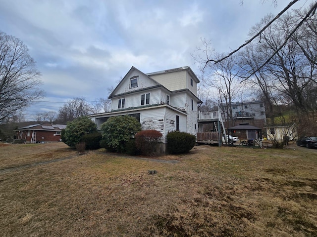 view of property exterior with a gazebo and a lawn